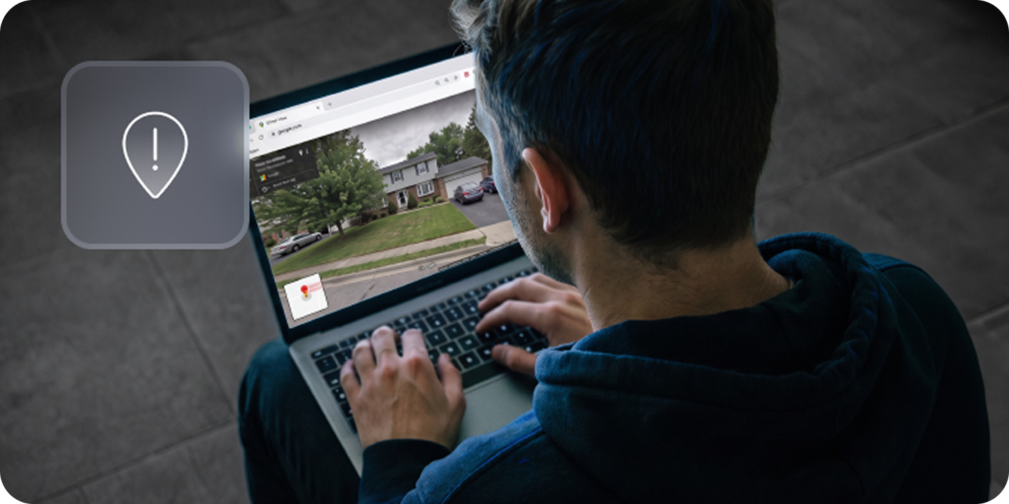 Person viewing a house on a laptop